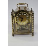 A German 'Anniversary' clock brass cased 'Koma' with key twisted column and cut glass sides