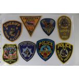 A large collection of United States Police Department Shoulder Sleeve insignia.