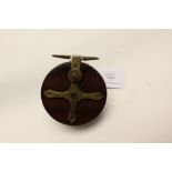 Angling interest: a wooden 'Star Back' fishing reel,