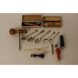 A mixed lot to include spoons, a boxwood thermometer, corkscrew, thimble,