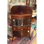 A George III mahogany corner washstand, 108cm high, 59cm wide,