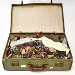 A suitcase of gents vintage waistcoats to include Dunn and Co,