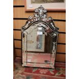 A Venetian etched glass mirror