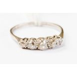 A diamond and platinum five stone ring, claw set with old cut diamonds, size Q,