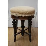 A late Victorian Aesthetic rosewood revolving piano stool,