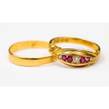 A ruby and diamond 18ct gold ring, set with four rubies and three old cut diamonds, size N,