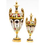 Royal Crown Derby large twin handled vase with fixed cover and a smaller version, pattern 1128,