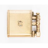 A 9ct gold Dunhill cigarette lighter, flint action, engine turned body with intials J.