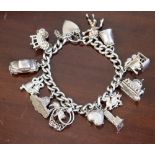 One silver charm bracelet with fourteen trinkets (inc lock)