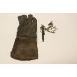 A vintage Falconry glove and lure