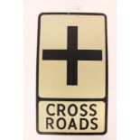 A reflective 'Cross Roads' road sign Franco