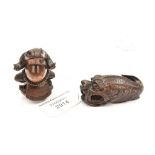 Two hardwood carved Netsukes, one in the form of a Toad, the other in the form of a Catfish,