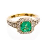 An emerald and diamond 18ct gold octagonal halo cluster ring,