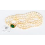 A double row string of cultured pearls with 14k textured gold and jade clasp,