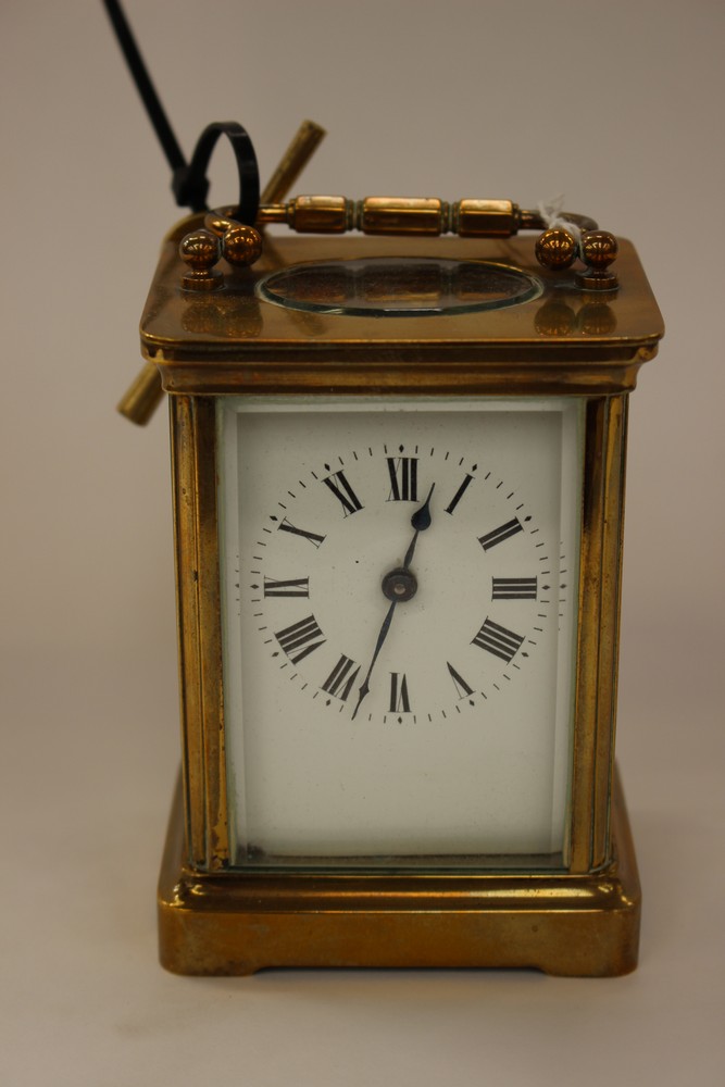A gilt brass carriage timepiece, white dial,