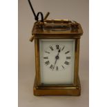 A gilt brass carriage timepiece, white dial,