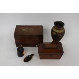 A cased singer sewing machine with a mahogany tea caddy and inlaid sewing box (in need of