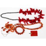 A collection of coral necklaces, to include a rectangular coral and silver pendant,