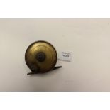 Angling interest: a brass fishing reel, possibly Victorian,