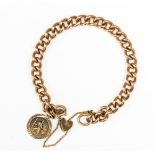A 9ct gold curblink bracelet, rose gold with St Christopher charm and locket fastener, approx 27.