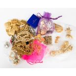 A bag of designer costume jewellery with names such as YSL, Fendi, Monet, schiparelli, Trifari,