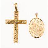 A 9ct gold cross, set with paste white stones and heavily engraved scrolled detail edges,