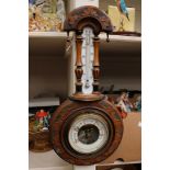 A mahogany wheel barometer having thermometer mounted on original ceramic mount