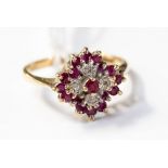 A diamond and ruby fancy cluster ring, in 9ct gold, size P, with a total gross weight approx 3.