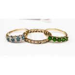 Three 9ct gold rings including a blue and white stone ring,