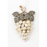 A seed pearl and diamond stylised pendant/brooch in the form of grapes,