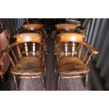A set of four 19th Century elm seated captains chairs (4)