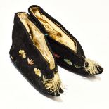 A pair of early 20th Century Chinese ladies shoes, black silk with embroidered butterflies,