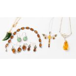A collection of amber and jadite jewellery including a silver and amber drop necklace,