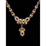A 14ct gold, sapphire and diamond ornate necklace,