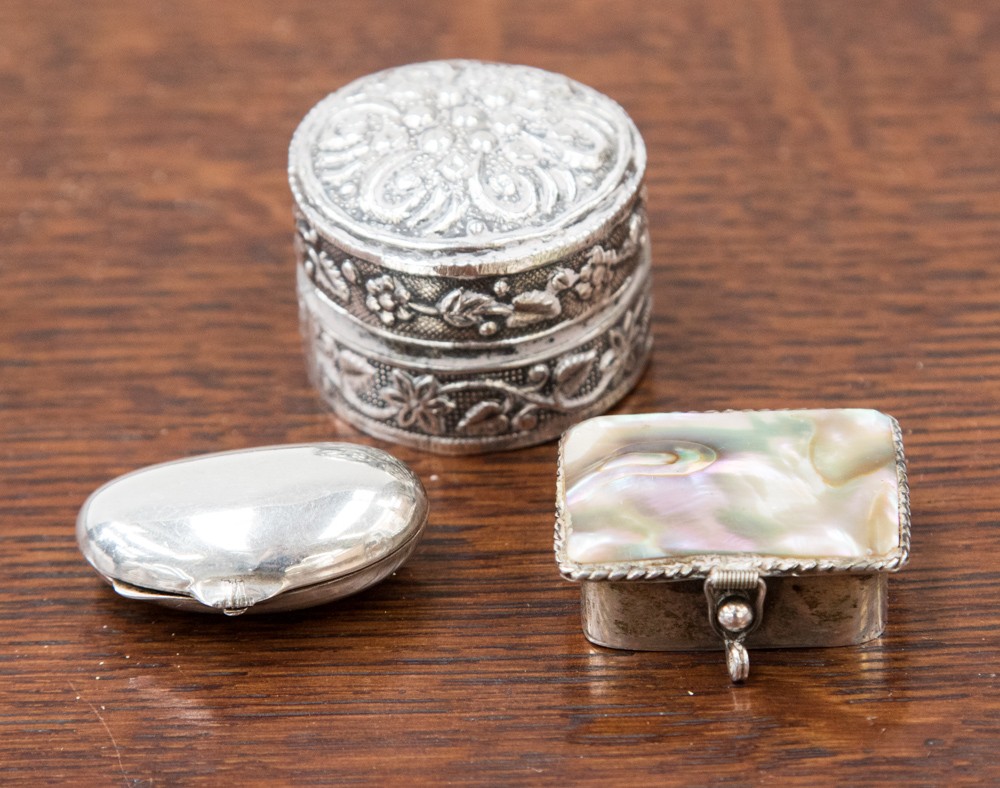 Two mexican silver pill boxes to include a Mexican Taxco abalone shell box,
