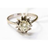 A diamond solitaire set in white metal, probably 18ct gold, with a fancy claw setting,