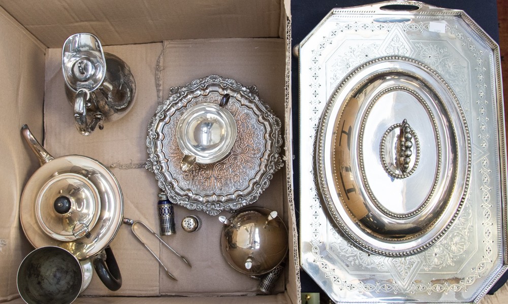 A silver muffin tin lid initialed to the front C.E.S and L.E.