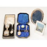 A George V Christening set including egg cup, napkin ring and spoon,