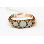 A 9ct gold, opal and diamond boat style ring,