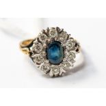 A sapphire and diamond ring set in 18ct yellow gold,