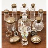 A collection of silver and scent bottles, dressing table bottles and a hip flask,