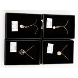 A group of four 9ct gold pendants, three set with cubic zirconia and one with rose quartz,