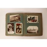 Early 20th-century postcard album containing approx.