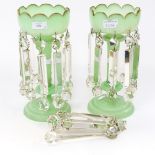 A pair of opaque green glass lustre vases with cut glass droplets plus a bag of spare glass