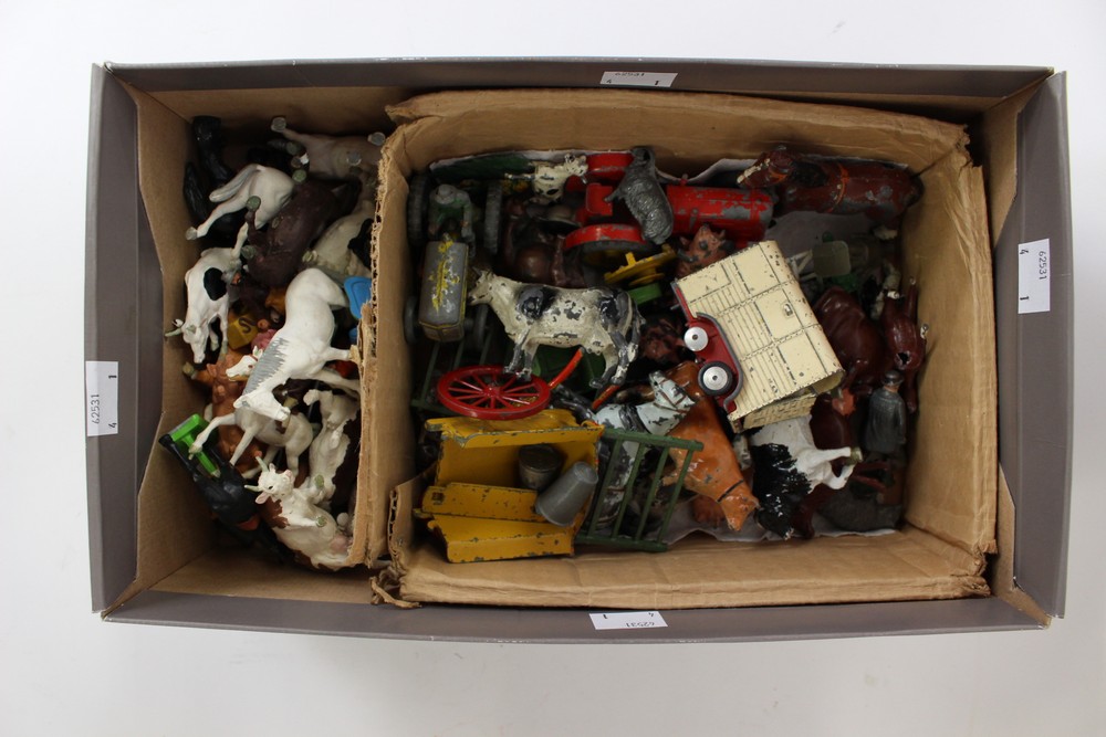 A box of Britain's farm animals and vehicles with assorted plastic farm animals,