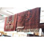 Three various early 20th Century hand knotted woollen rugs,