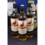 Three bottles of the Famous Grouse whisky