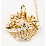 A circa 1940's yellow metal small brooch styled as a basket of flowers set with small diamonds