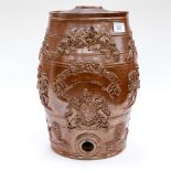 A Stoneware Wine/ Gin Barrel embossed with Grape vines, a coat of arms ,