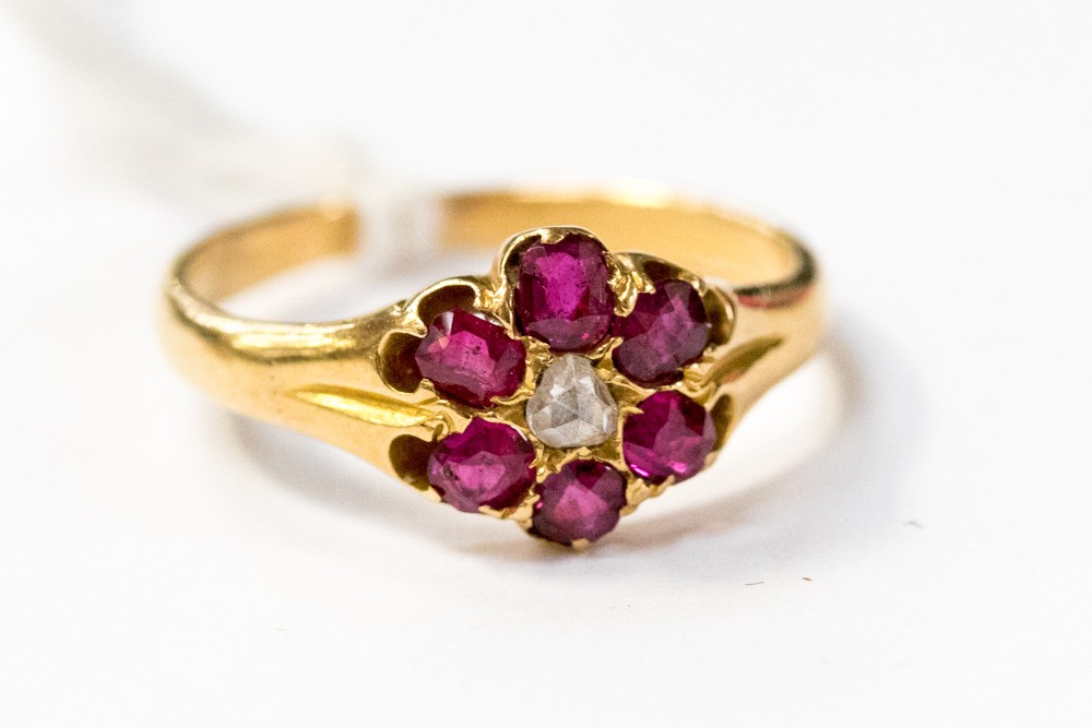 An ruby and diamond 18ct gold ring,